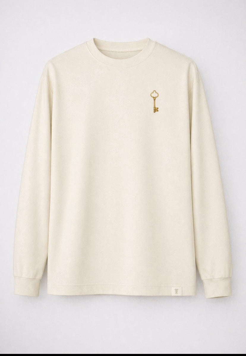 You feel it before you see it. Key of Blessings™ Long-Sleeve Signature Top – Ivory