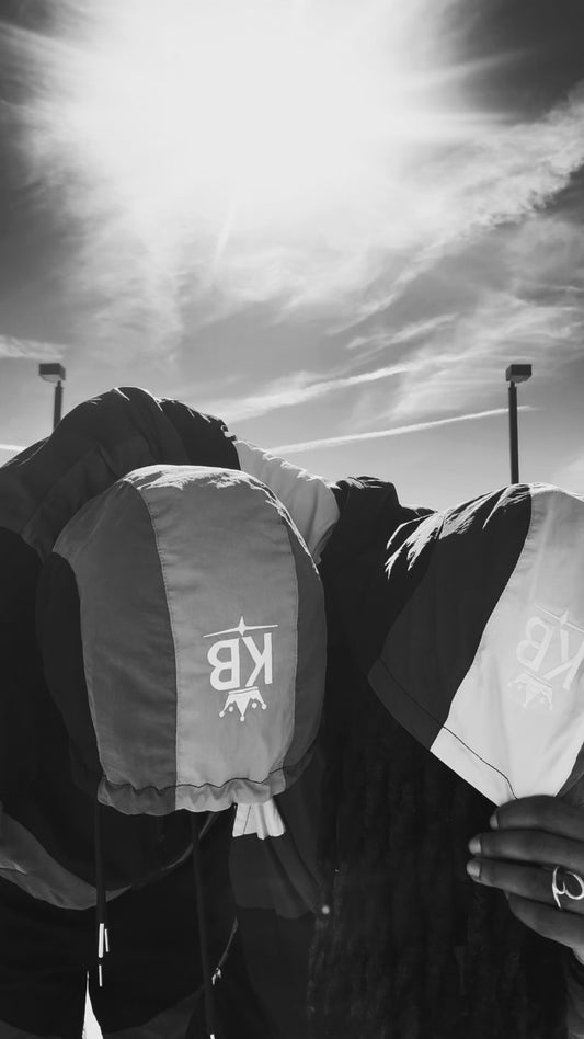 Clarity creates power. KB Signature Black Colorblock Windbreaker & Shorts